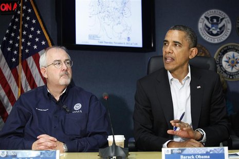 U.S. President Barack Obama (R), sitting with Federal Emergency Management Agency (FEMA) administrator William Craig Fugate (L), talks to re U.S. President Barack Obama (R), sitting with Federal Emergency Management Agency (FEMA) administrator William Craig Fugate (L), talks to re