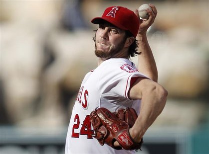 Los Angeles Angels starting pitcher Dan Haren delivers against the Texas Rangers during the first inning of an MLB baseball game in Anaheim, Los Angeles Angels starting pitcher Dan Haren delivers against the Texas Rangers during the first inning of an MLB baseball game in Anaheim,