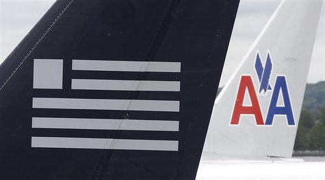 A US Airways plane and an American Airlines plane share a terminal at Ronald Reagan National Airport in Washington April 23, 2012. REUTERS/K A US Airways plane and an American Airlines plane share a terminal at Ronald Reagan National Airport in Washington April 23, 2012. REUTERS/K