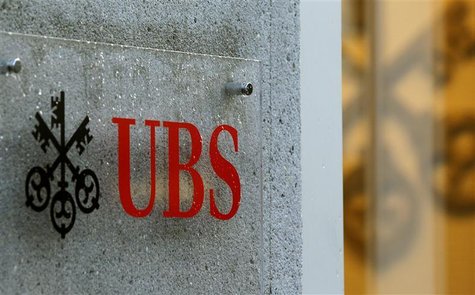 The company's logo is placed in front of an office of Swiss bank UBS in Zurich December 4, 2012. REUTERS/Arnd Wiegmann The company's logo is placed in front of an office of Swiss bank UBS in Zurich December 4, 2012. REUTERS/Arnd Wiegmann
