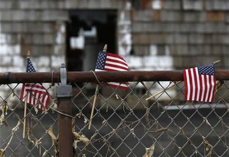 American flags are seen outside a home damaged from Hurricane Sandy in Lindenhurst, New York December 4, 2012. REUTERS/Shannon Stapleton American flags are seen outside a home damaged from Hurricane Sandy in Lindenhurst, New York December 4, 2012. REUTERS/Shannon Stapleton