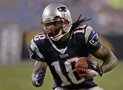 New England Patriots' wide receiver Donte Stallworth advances with the ball during second half pre-season NFL action in Charlotte, North Car New England Patriots' wide receiver Donte Stallworth advances with the ball during second half pre-season NFL action in Charlotte, North Car