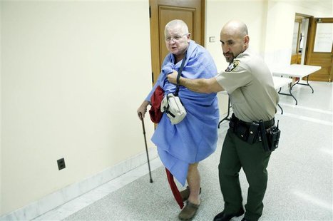 A San Francisco Sheriff's Deputy removes a nude protester who removed his clothes in the supervisors' legislative chambers in San Francisco A San Francisco Sheriff's Deputy removes a nude protester who removed his clothes in the supervisors' legislative chambers in San Francisco