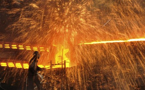A labourer works at a steel factory in Dalian, Liaoning province December 4, 2012. REUTERS/China Daily A labourer works at a steel factory in Dalian, Liaoning province December 4, 2012. REUTERS/China Daily