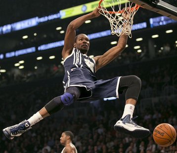 Oklahoma City Thunder forward Kevin Durant stuffs the ball against the Brooklyn Nets in the second quarter of their NBA basketball game in N Oklahoma City Thunder forward Kevin Durant stuffs the ball against the Brooklyn Nets in the second quarter of their NBA basketball game in N