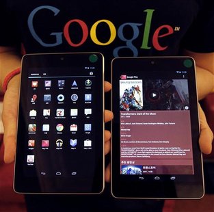 A Google employee poses with Nexus 7 tablets at a promotional event in Seoul September 27, 2012. REUTERS/Kim Hong-Ji A Google employee poses with Nexus 7 tablets at a promotional event in Seoul September 27, 2012. REUTERS/Kim Hong-Ji