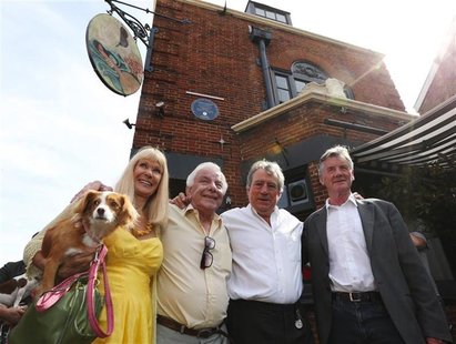 Monty Python's Flying Circus actors (L-R) Carol Cleveland, former colleague Barry Cryer, actor Terry Jones and Michael Palin pose outside th Monty Python's Flying Circus actors (L-R) Carol Cleveland, former colleague Barry Cryer, actor Terry Jones and Michael Palin pose outside th