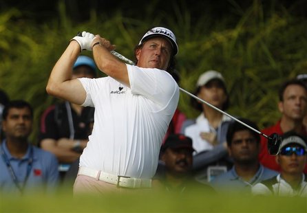 Phil Mickelson of the U.S. tees off on the 12th hole during the first round of the Barclays Singapore Open golf tournament in Sentosa Novemb Phil Mickelson of the U.S. tees off on the 12th hole during the first round of the Barclays Singapore Open golf tournament in Sentosa Novemb