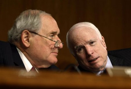 U.S. Senate Armed Services Committee Chairman Carl Levin (L)(D-MI) and Ranking Republican John McCain (R-AZ) confer during the confirmation U.S. Senate Armed Services Committee Chairman Carl Levin (L)(D-MI) and Ranking Republican John McCain (R-AZ) confer during the confirmation