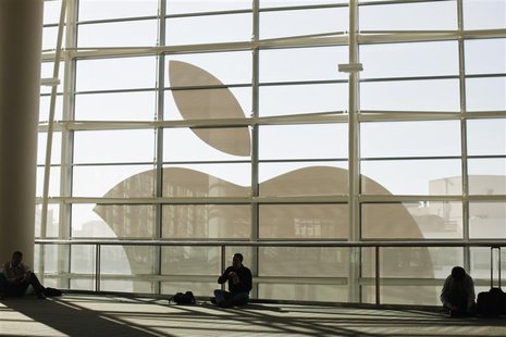 Attendees sit in front of an Apple logo during the Apple Worldwide Developers Conference 2012 in San Francisco, California June 11, 2012. RE Attendees sit in front of an Apple logo during the Apple Worldwide Developers Conference 2012 in San Francisco, California June 11, 2012. RE