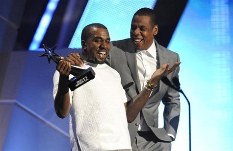 Kanye West and Jay-Z (R) accept the award for best group at the 2012 BET Awards in Los Angeles, July 1, 2012. REUTERS/Phil McCarten Kanye West and Jay-Z (R) accept the award for best group at the 2012 BET Awards in Los Angeles, July 1, 2012. REUTERS/Phil McCarten