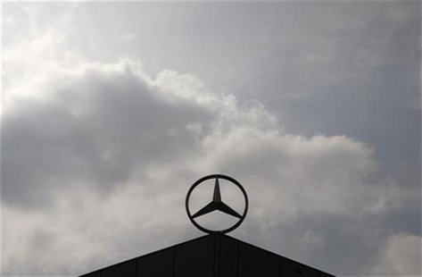 A Mercedes Benz logo is silhouetted against the sky at a newly completed factory of German car maker Daimler in Kecskemet, 90km (56 miles) e A Mercedes Benz logo is silhouetted against the sky at a newly completed factory of German car maker Daimler in Kecskemet, 90km (56 miles) e