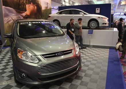 The 2013 Ford C-Max Energi (L) and 2013 Ford Fusion Energi hybrids are displayed in the lobby of the Las Vegas Convention Center during the The 2013 Ford C-Max Energi (L) and 2013 Ford Fusion Energi hybrids are displayed in the lobby of the Las Vegas Convention Center during the