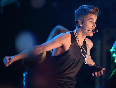 Canadian singer Justin Bieber performs during the halftime show during the 100th CFL Grey Cup championship football game in Toronto, Novembe Canadian singer Justin Bieber performs during the halftime show during the 100th CFL Grey Cup championship football game in Toronto, Novembe