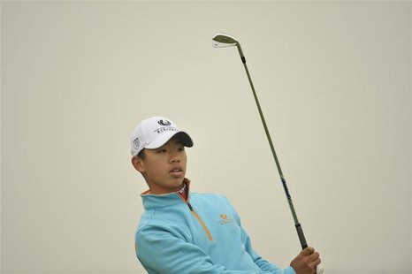 Guan Tian-Lang of China watches his shot during the Championship Pro-Am of the Volvo China Open at Binhai Lake Golf Club in Tianjin municipa Guan Tian-Lang of China watches his shot during the Championship Pro-Am of the Volvo China Open at Binhai Lake Golf Club in Tianjin municipa