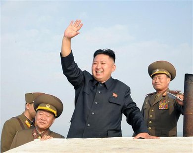 North Korean leader Kim Jong-Un (C) waves as he visits military units on islands in the most southwest of Pyongyang in this picture released North Korean leader Kim Jong-Un (C) waves as he visits military units on islands in the most southwest of Pyongyang in this picture released