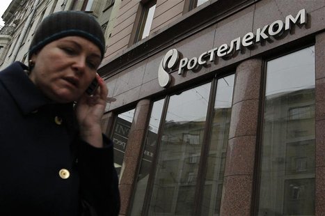 A woman passes by an office of Russian telecoms firm Rostelecom in Moscow, November 21, 2012. REUTERS/Maxim Shemetov A woman passes by an office of Russian telecoms firm Rostelecom in Moscow, November 21, 2012. REUTERS/Maxim Shemetov