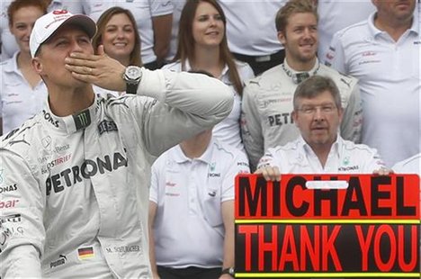 Mercedes Formula One driver Michael Schumacher of Germany gestures during a photo call before the Brazilian F1 Grand Prix at Interlagos circ Mercedes Formula One driver Michael Schumacher of Germany gestures during a photo call before the Brazilian F1 Grand Prix at Interlagos circ