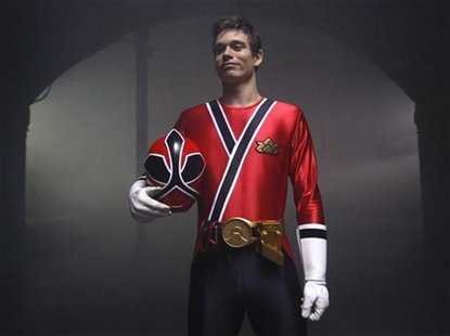 British Tae Kwon Do champion Aaron Cook poses wearing a Power Rangers outfit during a break in filming a promotional film at a location in c British Tae Kwon Do champion Aaron Cook poses wearing a Power Rangers outfit during a break in filming a promotional film at a location in c