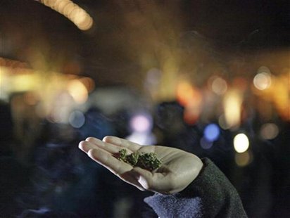 Marijuana is seen in the hand of a person after the law legalizing the recreational use of marijuana went into effect in Seattle, Washington Marijuana is seen in the hand of a person after the law legalizing the recreational use of marijuana went into effect in Seattle, Washington