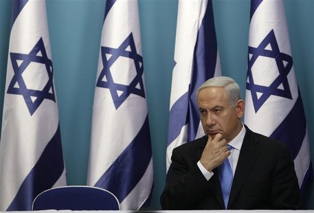 Israel's Prime Minister Benjamin Netanyahu sits after delivering a statement in Jerusalem November 21, 2012. REUTERS/Baz Ratner Israel's Prime Minister Benjamin Netanyahu sits after delivering a statement in Jerusalem November 21, 2012. REUTERS/Baz Ratner