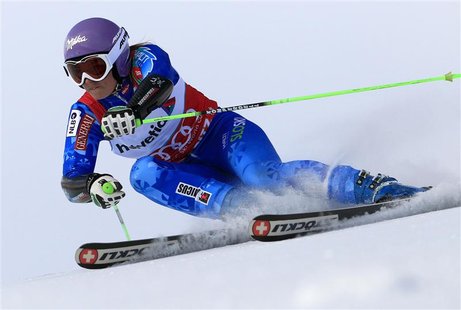 Tina Maze of Slovenia speeds down during the first run of the Giant slalom race at the women's Alpine skiing World Cup at the Corviglia in t Tina Maze of Slovenia speeds down during the first run of the Giant slalom race at the women's Alpine skiing World Cup at the Corviglia in t