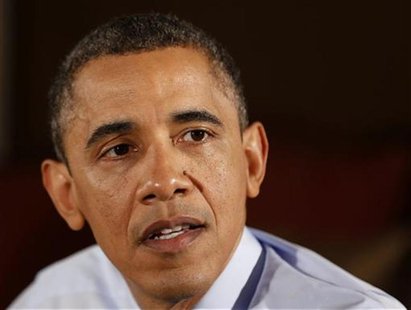 U.S. President Barack Obama speaks while visiting middle class family members in their home to discuss his Administration's push to cut taxe U.S. President Barack Obama speaks while visiting middle class family members in their home to discuss his Administration's push to cut taxe
