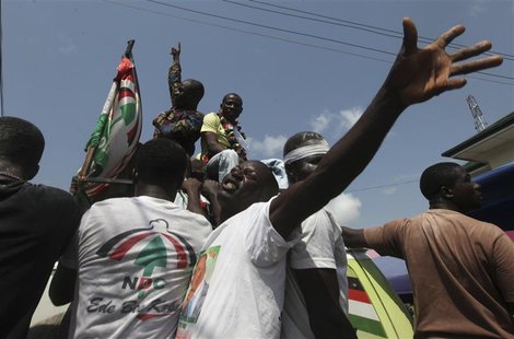 Supporters of National Democratic Congress (NDC) celebrate the victory of their candidate, John Dramani Mahama, on a street in Accra Decembe Supporters of National Democratic Congress (NDC) celebrate the victory of their candidate, John Dramani Mahama, on a street in Accra Decembe