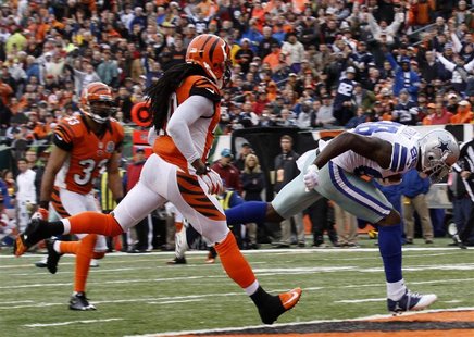 Dallas Cowboys wide receiver Dez Bryant runs in for the touchdown ahead of Cincinnati Bengals' Reggie Nelson (L) during the second half of p Dallas Cowboys wide receiver Dez Bryant runs in for the touchdown ahead of Cincinnati Bengals' Reggie Nelson (L) during the second half of p