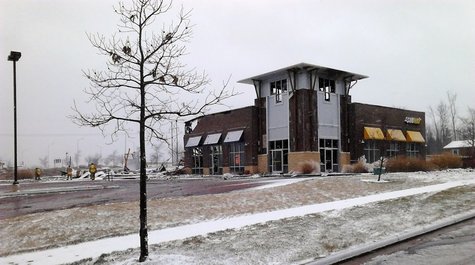Firefighters clean of the scene of a strip mall fire in Weston that totaled the building, December 9, 2012 Firefighters clean of the scene of a strip mall fire in Weston that totaled the building, December 9, 2012