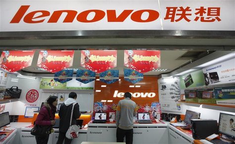 Customers talk to a salesperson about a new laptop at a Lenovo shop in Shanghai February 17, 2011. REUTERS/Aly Song Customers talk to a salesperson about a new laptop at a Lenovo shop in Shanghai February 17, 2011. REUTERS/Aly Song