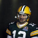 Green Bay Packers quarterback Aaron Rodgers waits to be announced before the game against the Detroit Lions in a NFL football game in Green Green Bay Packers quarterback Aaron Rodgers waits to be announced before the game against the Detroit Lions in a NFL football game in Green