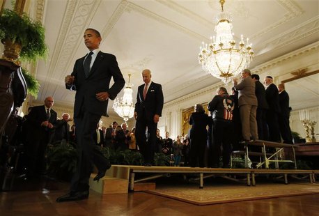 President Barack Obama and Vice President Joe Biden walk from the stage, following remarks on the impending "fiscal cliff" talks with Congre President Barack Obama and Vice President Joe Biden walk from the stage, following remarks on the impending "fiscal cliff" talks with Congre