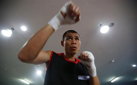 Chris "The Dragon" John of Indonesia shadow boxes during an open training session ahead of his fight at a gym in Singapore November 6, 2012. Chris "The Dragon" John of Indonesia shadow boxes during an open training session ahead of his fight at a gym in Singapore November 6, 2012.