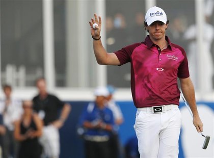 Rory McIlroy of Northern Ireland gestures at the 18th green during the third round of the DP World Tour Championship at Jumeirah Golf Estate Rory McIlroy of Northern Ireland gestures at the 18th green during the third round of the DP World Tour Championship at Jumeirah Golf Estate