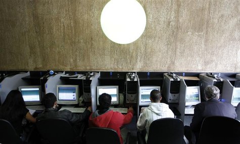 Customers use computers at an internet cafe in Sao Paulo March 3, 2011. REUTERS/Nacho Doce Customers use computers at an internet cafe in Sao Paulo March 3, 2011. REUTERS/Nacho Doce