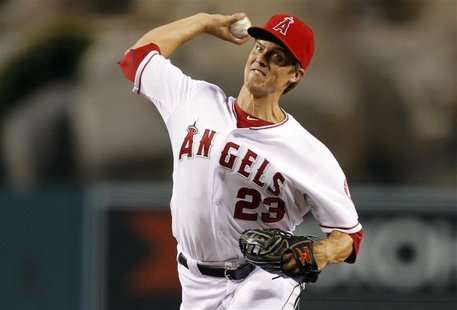Los Angeles Angels starting pitcher Zack Greinke delivers a pitch against the Texas Rangers during the first inning of their MLB baseball ga Los Angeles Angels starting pitcher Zack Greinke delivers a pitch against the Texas Rangers during the first inning of their MLB baseball ga