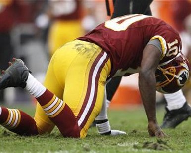 Washington Redskins quarterback Robert Griffin III gets up slowly after being tackled by the Baltimore Ravens defense in the first half of their NFL football game in Landover, Maryland December 9, 2012. This is not the play in which Griffin III left the game.
REUTERS/Gary Cameron Washington Redskins quarterback Robert Griffin III gets up slowly after being tackled by the Baltimore Ravens defense in the first half of their NFL football game in Landover, Maryland December 9, 2012. This is not the play in which Griffin III left the game.
REUTERS/Gary Cameron