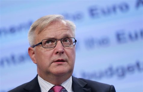 European Economic and Monetary Affairs Commissioner Olli Rehn speaks during a joint news conference with EU Commission President Jose Manuel European Economic and Monetary Affairs Commissioner Olli Rehn speaks during a joint news conference with EU Commission President Jose Manuel