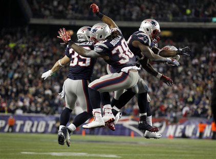 New England Patriots Danny Woodhead (L), Brandon Bolden (C) and Stevan Ridley celebrate after the Patriots scored a touchdown against the Ho New England Patriots Danny Woodhead (L), Brandon Bolden (C) and Stevan Ridley celebrate after the Patriots scored a touchdown against the Ho