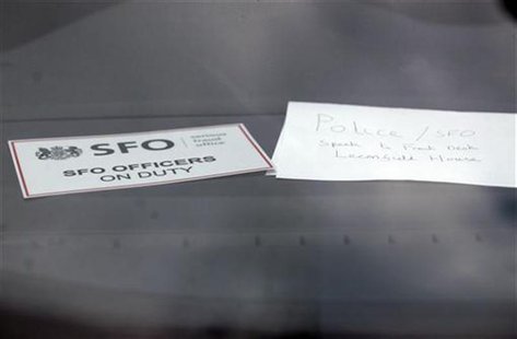 A sign is displayed in an unmarked Serious Fraud Office vehicle parked outside a building, in Mayfair, central London March 9, 2011. REUTERS A sign is displayed in an unmarked Serious Fraud Office vehicle parked outside a building, in Mayfair, central London March 9, 2011. REUTERS