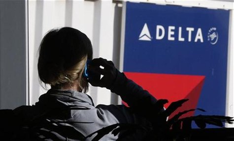 A passenger talks on her phone at a Delta Airlines gate a day before the annual Thanksgiving Day holiday at the Salt Lake City international A passenger talks on her phone at a Delta Airlines gate a day before the annual Thanksgiving Day holiday at the Salt Lake City international