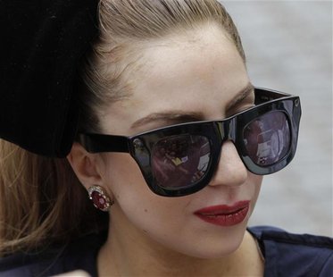 Singer Lady Gaga signs autographs for fans in front of Sheraton Hotel in Asuncion November 26, 2012. REUTERS/Jorge Adorno Singer Lady Gaga signs autographs for fans in front of Sheraton Hotel in Asuncion November 26, 2012. REUTERS/Jorge Adorno