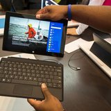 Sales staff demonstrate the Microsoft Surface during the opening of Microsoft's retail store in New York's Times Square October 25, 2012. RE Sales staff demonstrate the Microsoft Surface during the opening of Microsoft's retail store in New York's Times Square October 25, 2012. RE