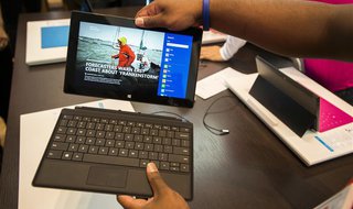 Sales staff demonstrate the Microsoft Surface during the opening of Microsoft's retail store in New York's Times Square October 25, 2012. RE Sales staff demonstrate the Microsoft Surface during the opening of Microsoft's retail store in New York's Times Square October 25, 2012. RE