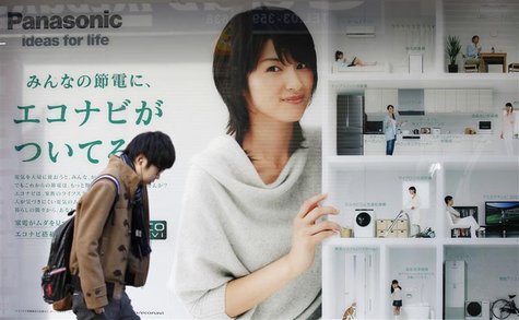 A man walks past an advertisement board of Panasonic outside an electronic shop in Tokyo February 3, 2012. REUTERS/Kim Kyung-Hoon A man walks past an advertisement board of Panasonic outside an electronic shop in Tokyo February 3, 2012. REUTERS/Kim Kyung-Hoon