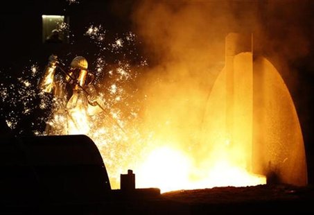 A worker controls a tapping of a blast furnace at Europe's largest steel factory of Germany's industrial conglomerate ThyssenKrupp AG in the A worker controls a tapping of a blast furnace at Europe's largest steel factory of Germany's industrial conglomerate ThyssenKrupp AG in the