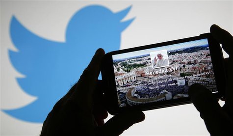 Pope Benedict XVI's twitter account is pictured on a smart phone in front of the Twitter logo displayed on a laptop in this photo illustrati Pope Benedict XVI's twitter account is pictured on a smart phone in front of the Twitter logo displayed on a laptop in this photo illustrati