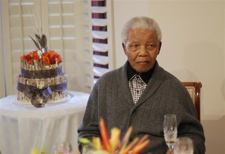 Former South African president Nelson Mandela looks on as he celebrates his birthday at his house in Qunu, Eastern Cape July 18, 2012. REUTE Former South African president Nelson Mandela looks on as he celebrates his birthday at his house in Qunu, Eastern Cape July 18, 2012. REUTE