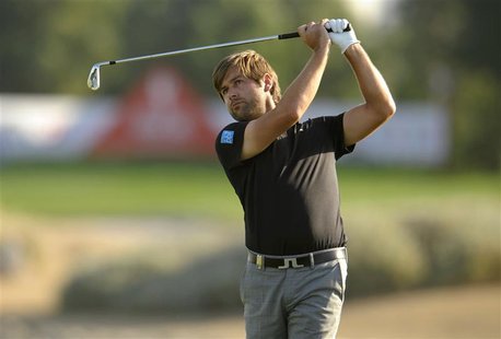 Robert Rock of England plays a shot on the 17th hole during the final round of the Abu Dhabi Championship at the Abu Dhabi Golf Club January Robert Rock of England plays a shot on the 17th hole during the final round of the Abu Dhabi Championship at the Abu Dhabi Golf Club January
